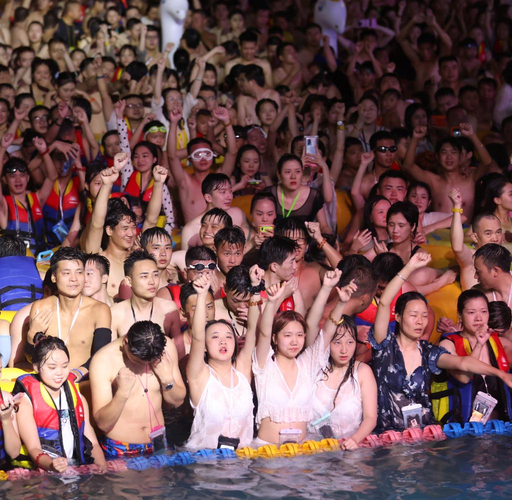 People-enjoy-a-music-party-at-the-Wuhan-Maya-Beach-Park-in-Wuhan.jpg